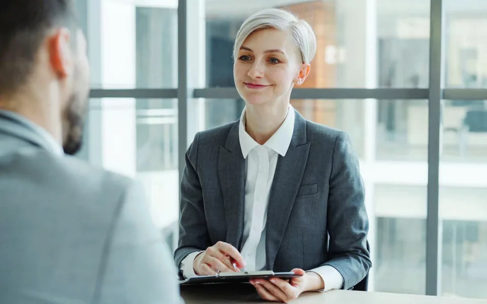 AI-edited stock photograph: an HR professional holds a personal conversation.